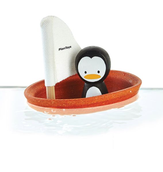 Bateau Pingouin en bois flottant sur l'eau - Plan Toys